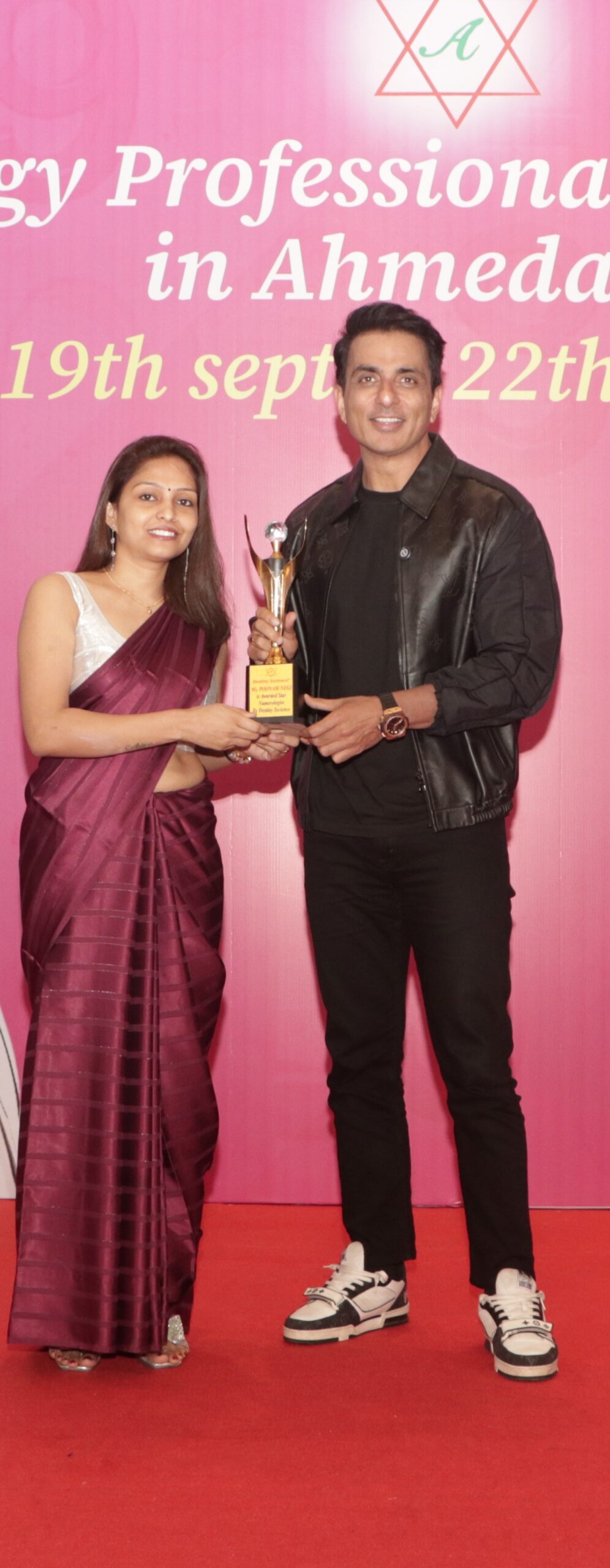 Poonam D Negi receiving professional recognition at an event